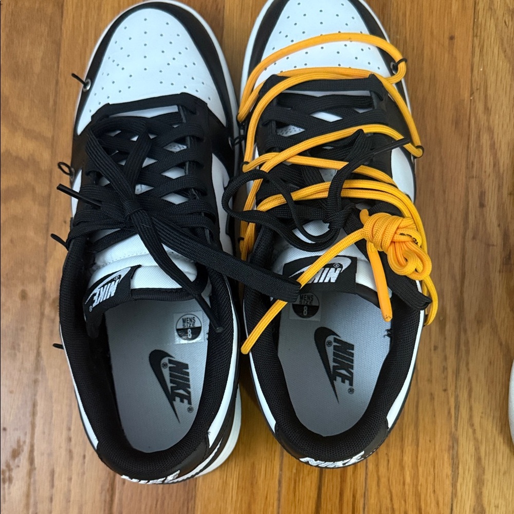 Nike White and Black Sneakers with Vibrant Orange Laces